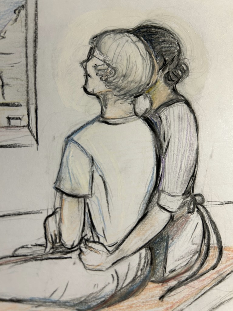 Two elderly women sitting on a bench